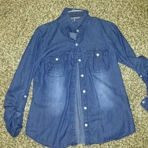 A bluish button-up dress shirt